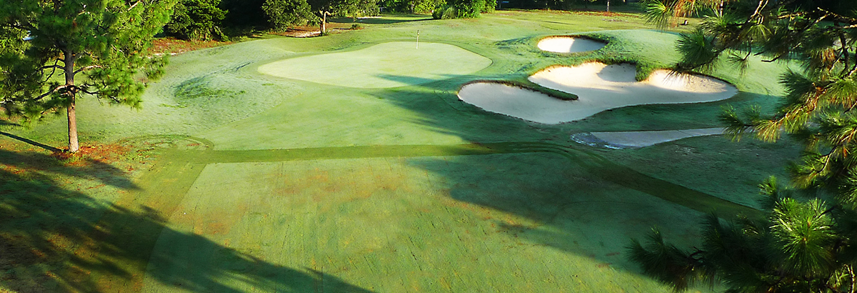 view of golf course with sand trap on the right